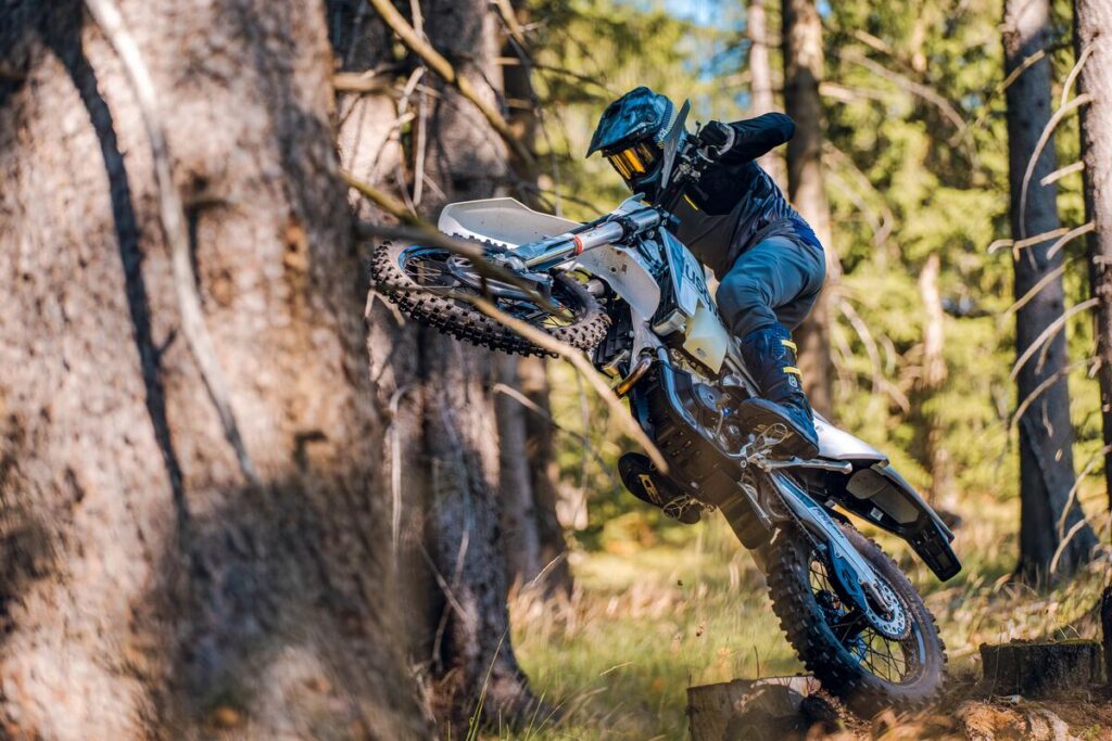 Husqvarna’s 2027 FE350 Pro being ridden in a forested area.