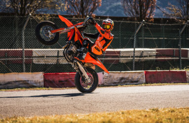 KTM'S 2027 450SMR SUPERMOTO doing a wheelie