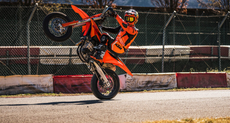 KTM'S 2027 450SMR SUPERMOTO doing a wheelie
