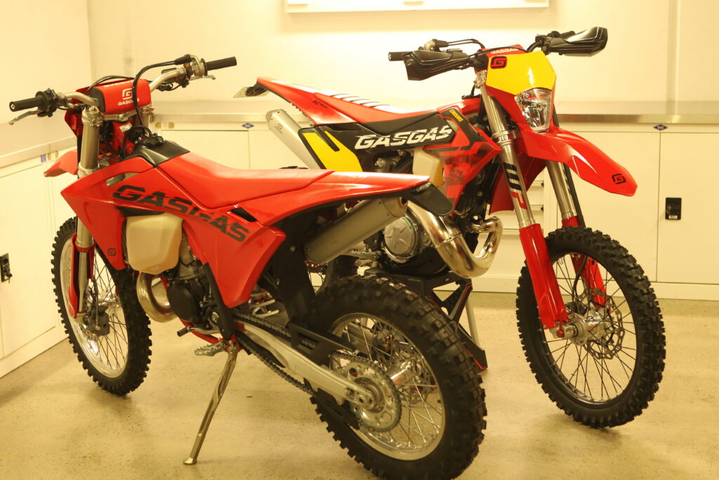 A GASGAS EC300 GP next to a GASGAS standard EC300.